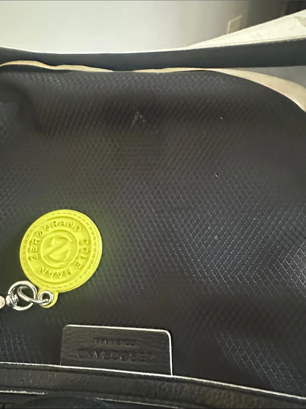 Cole Haan Zerogrand Convertible Nylon Backpack Tote in black with lime green